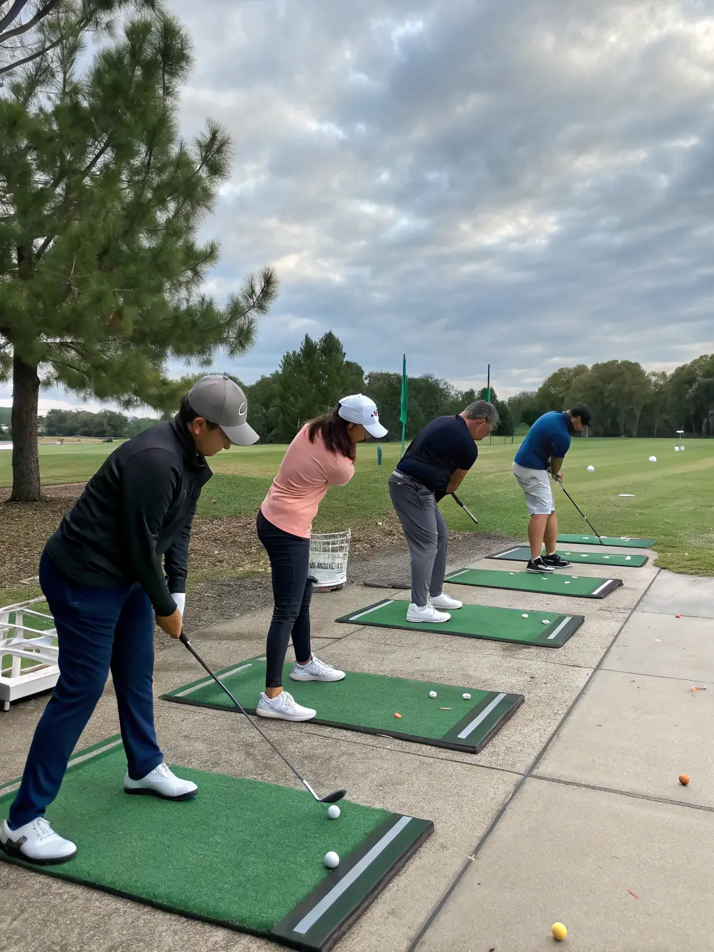 A senior golfer receiving instruction from a golf pro during a clinic, highlighting the skill-improvement aspect of SG4L programs.